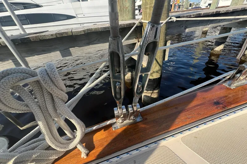 Slide: The Image of Rope and rigging on 1994 Island Packet 44 cutter sailboat docked at marina. - 32