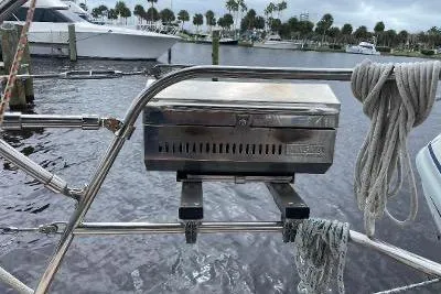 Slide: The Image of Stainless steel grill on 1994 Island Packet 44 cutter sailboat, docked by marina. - 45