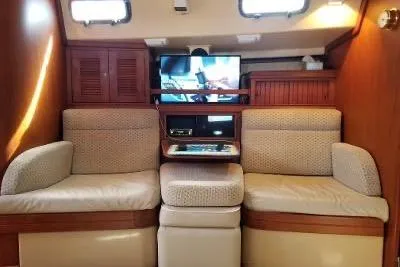 Slide: The Image of Interior of 1994 Island Packet 44 cutter with cozy seating and entertainment system. - 71