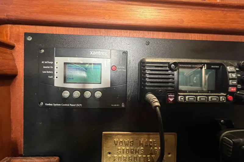 Slide: The Image of Control panel and radio equipment on a 1994 Island Packet 44 cutter sailboat. - 84