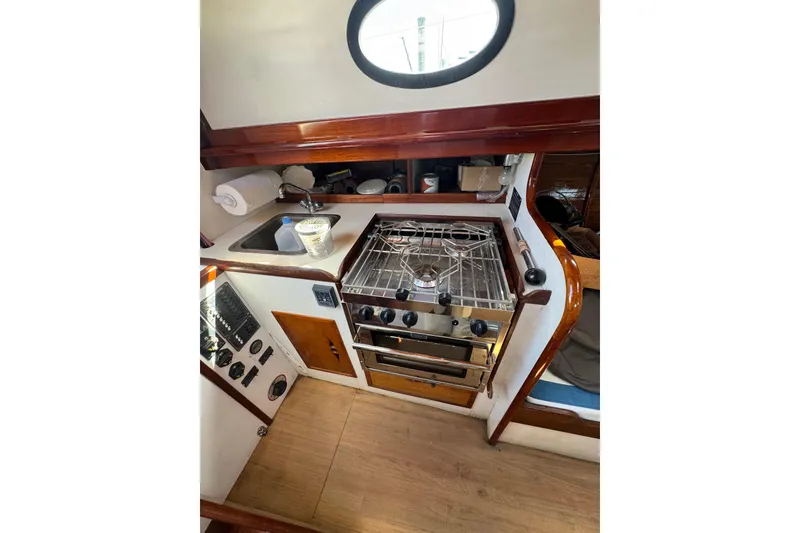 Slide: The Image of Engine compartment of a 1979 O.Lie-Neilsen 44 Cutter Rigged sailboat, featuring a red engine. - 40