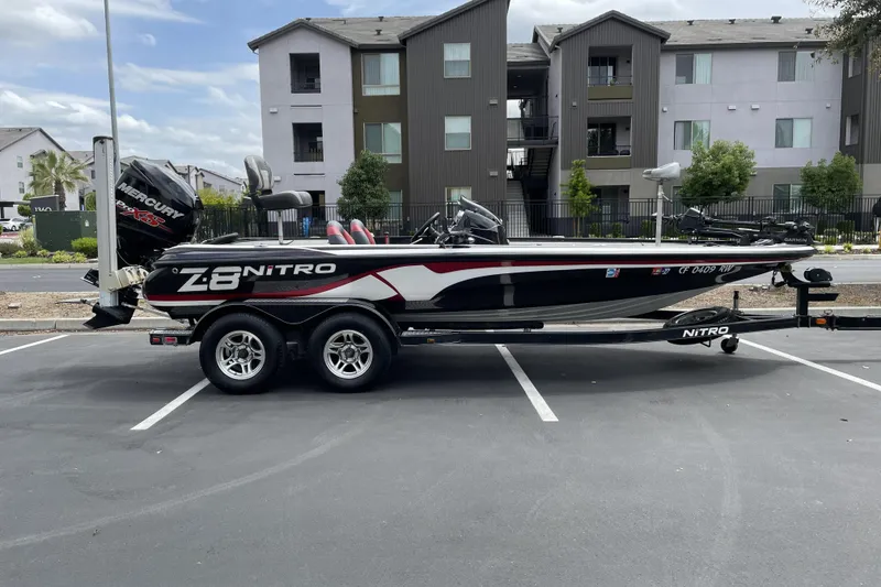 Slide: The Image of 2013 Nitro Z-8 boat with Mercury engine parked in urban setting. - 0