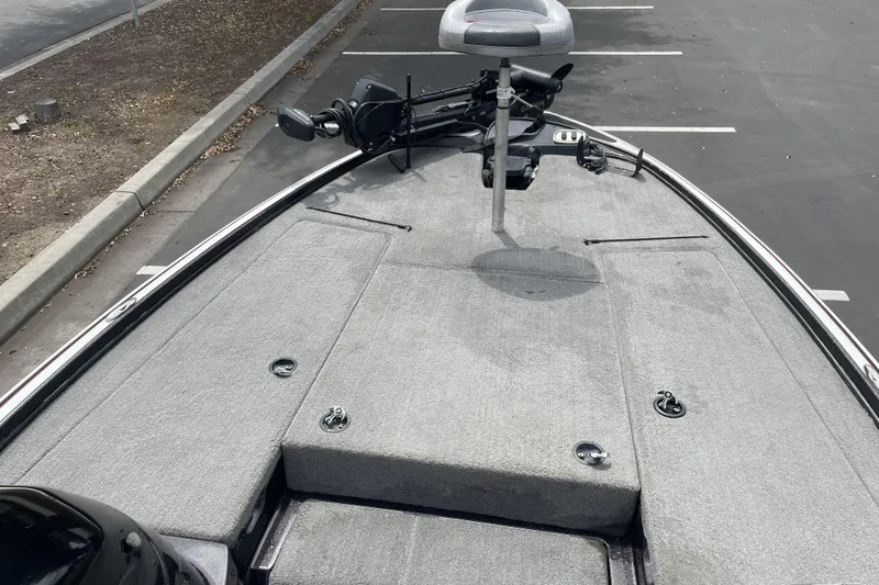 Slide: The Image of Front deck of a 2013 Nitro Z-8 boat in a parking lot. - 11