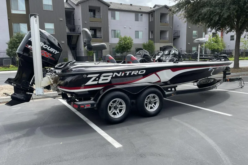 Slide: The Image of 2013 Nitro Z-8 boat with Mercury engine parked in a residential area. - 2