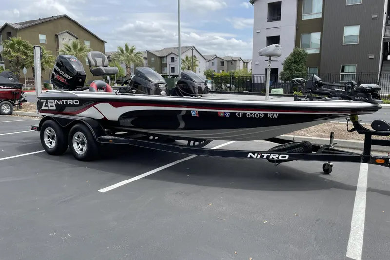 Slide: The Image of 2013 Nitro Z-8 boat with Mercury engine on trailer in parking lot. - 3