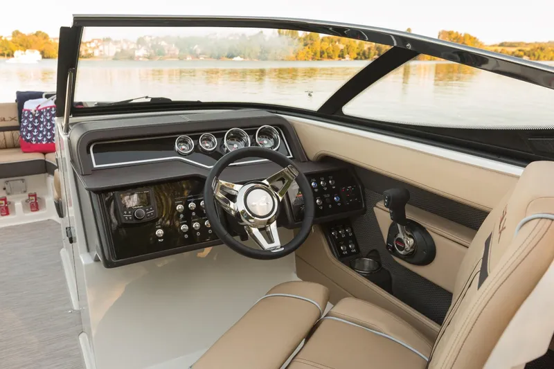 Slide: The Image of Interior of a 2016 Sea Ray SLX 250 boat with steering console. - 14