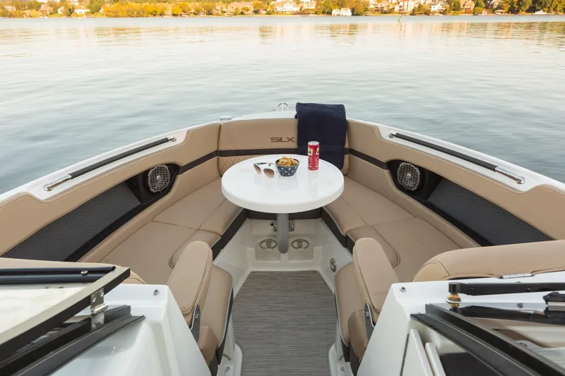 Slide: The Image of Interior of 2016 Sea Ray SLX 250 yacht with table and seating area. - 25