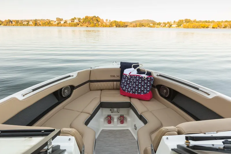 Slide: The Image of Interior of a 2016 Sea Ray SLX 250 yacht on calm waters. - 26