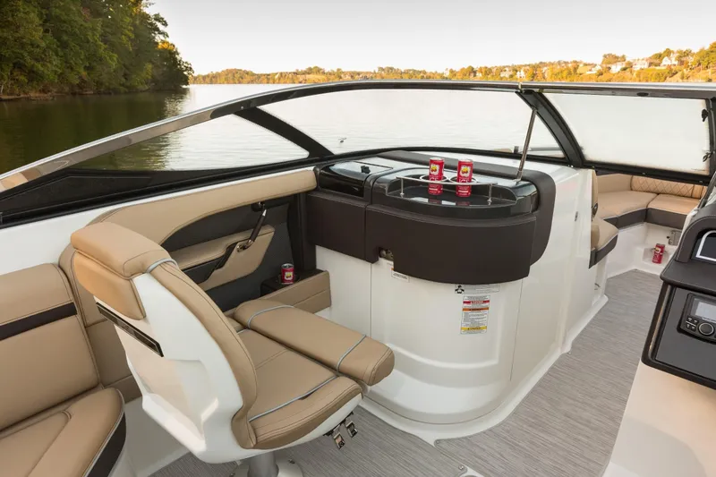 Slide: The Image of Interior of a 2016 Sea Ray SLX 250 with beige seating. - 28