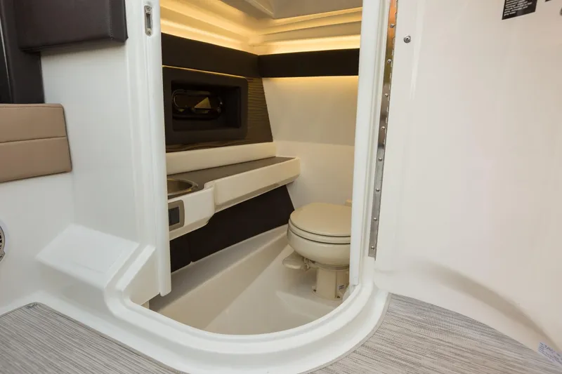 Slide: The Image of Interior of 2016 Sea Ray SLX 250 with toilet and sink. - 33