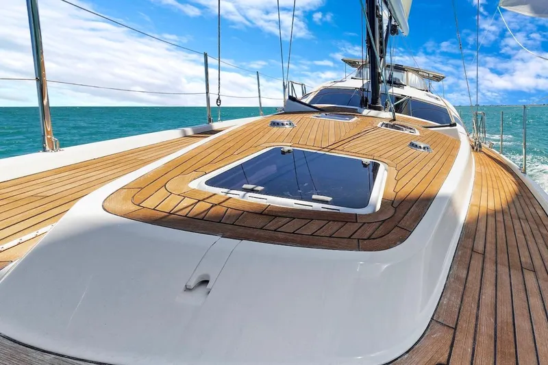 Slide: The Image of Luxurious 2011 Southerly 57 RS yacht deck with teak finish, sailing on open sea. - 11