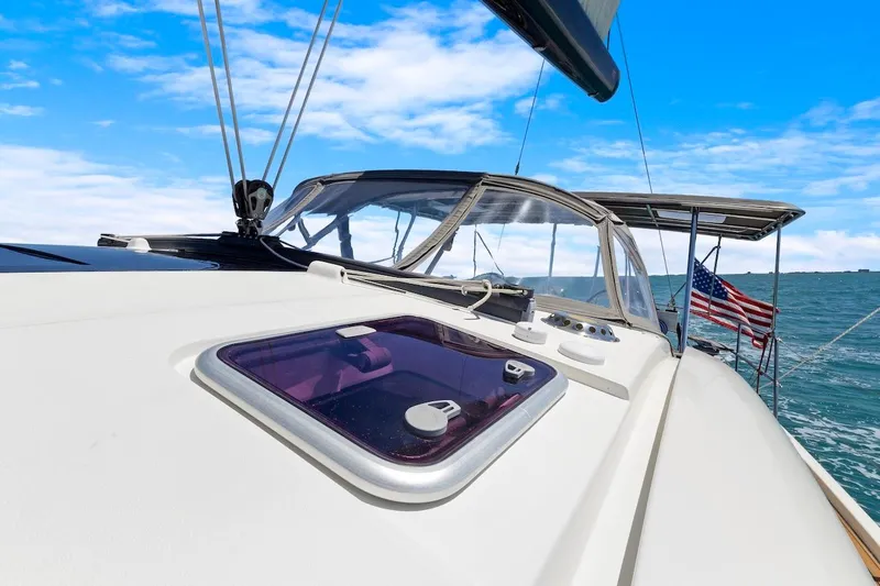 Slide: The Image of Sailing yacht Southerly 57 RS, 2011 model, on open sea with clear blue sky. - 16