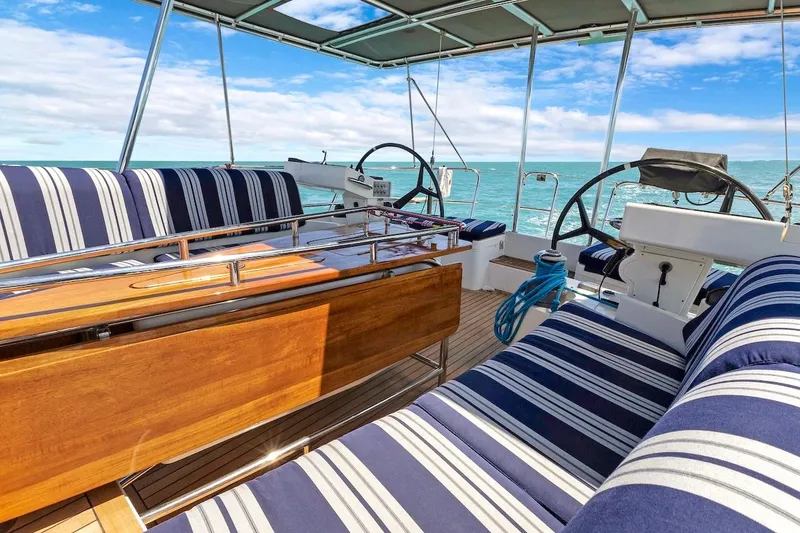 Slide: The Image of Luxurious 2011 Southerly 57 RS yacht interior with striped seating and ocean view. - 19