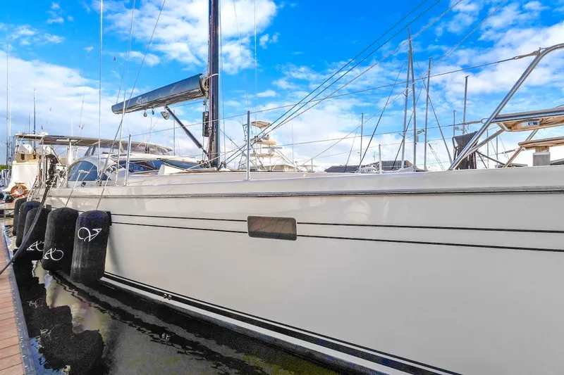 Slide: The Image of Sailing yacht Southerly 57 RS, 2011 model, docked at marina under blue sky. - 2