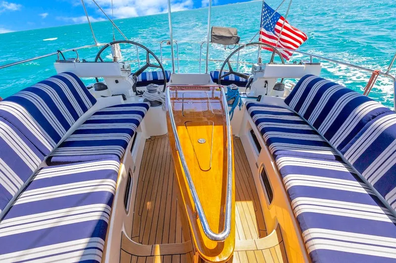 Slide: The Image of Luxurious 2011 Southerly 57 RS yacht deck with striped seating and ocean view. - 20