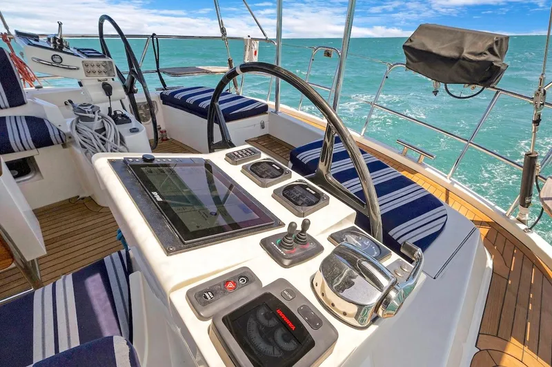 Slide: The Image of Cockpit of 2011 Southerly 57 RS yacht with navigation controls and ocean view. - 21