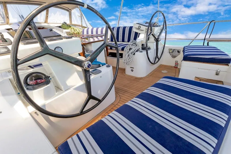 Slide: The Image of Cockpit of 2011 Southerly 57 RS yacht with striped seating and dual steering wheels. - 22