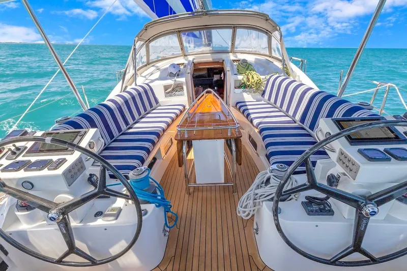 Slide: The Image of Cockpit of 2011 Southerly 57 RS yacht with striped seating and dual steering wheels. - 24