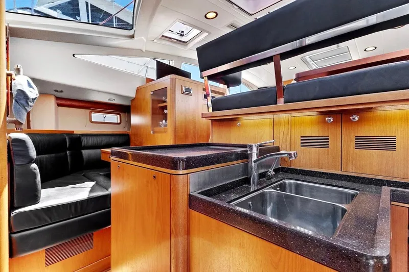 Slide: The Image of Luxurious interior of 2011 Southerly 57 RS yacht with modern kitchen and seating area. - 32