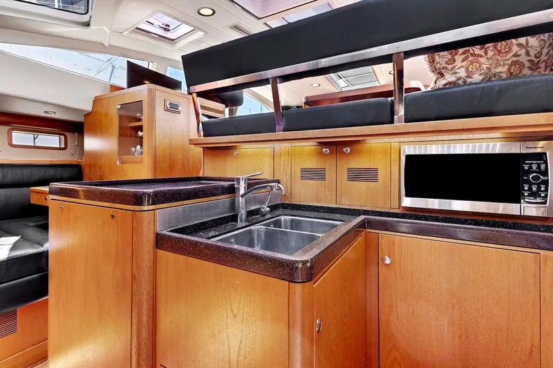 Slide: The Image of Luxurious interior of 2011 Southerly 57 RS yacht featuring modern kitchen amenities. - 33