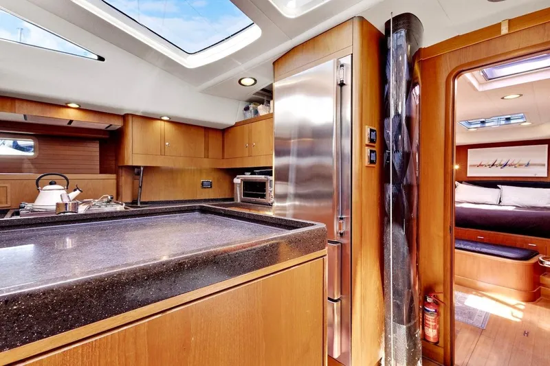 Slide: The Image of Luxurious interior of 2011 Southerly 57 RS yacht with modern kitchen and cozy cabin. - 36