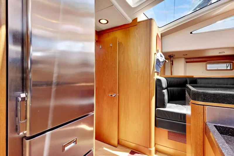 Slide: The Image of Interior of 2011 Southerly 57 RS yacht with modern kitchen and seating area. - 37