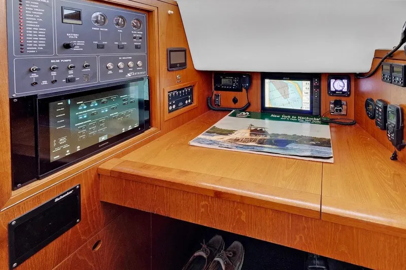 Slide: The Image of Navigation station of 2011 Southerly 57 RS yacht with control panels and map. - 41