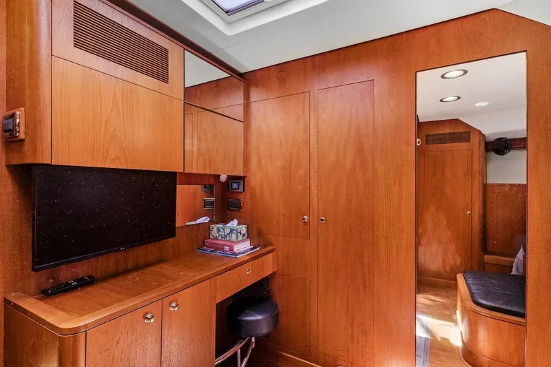 Slide: The Image of Luxurious wooden interior of 2011 Southerly 57 RS yacht with desk and mirror. - 48