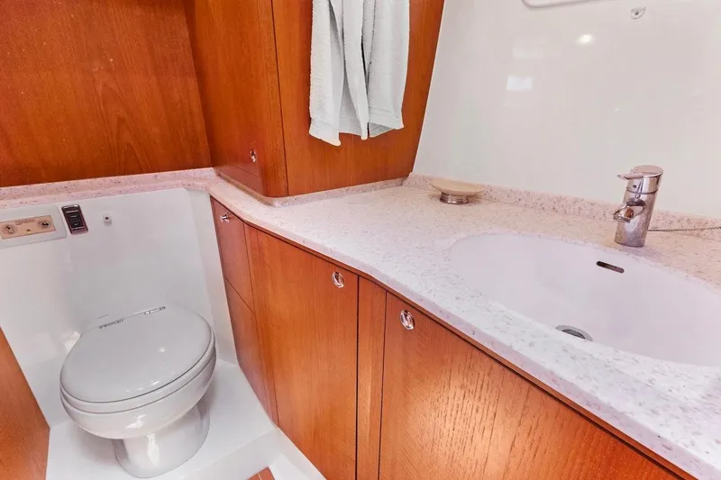 Slide: The Image of Luxurious bathroom in 2011 Southerly 57 RS yacht with wooden cabinetry and modern fixtures. - 51