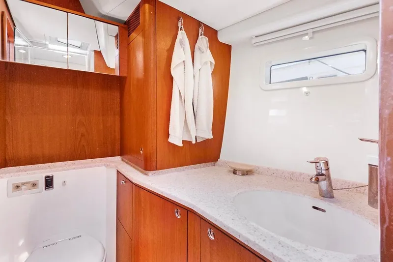 Slide: The Image of Luxurious bathroom interior of 2011 Southerly 57 RS yacht with wooden cabinetry. - 52