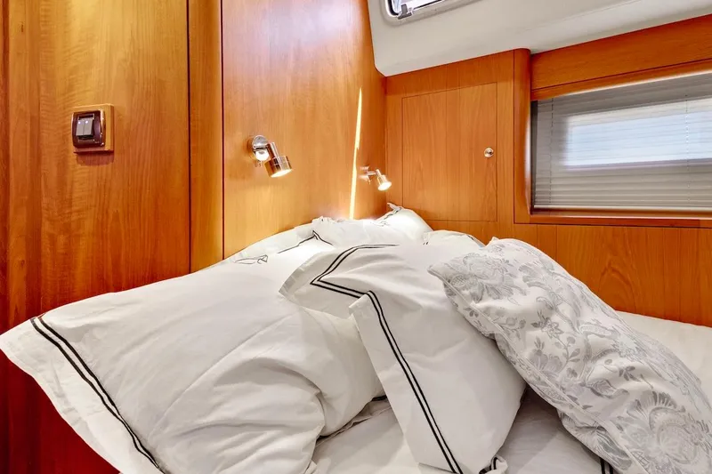 Slide: The Image of Luxurious cabin interior of 2011 Southerly 57 RS yacht with plush bedding. - 54