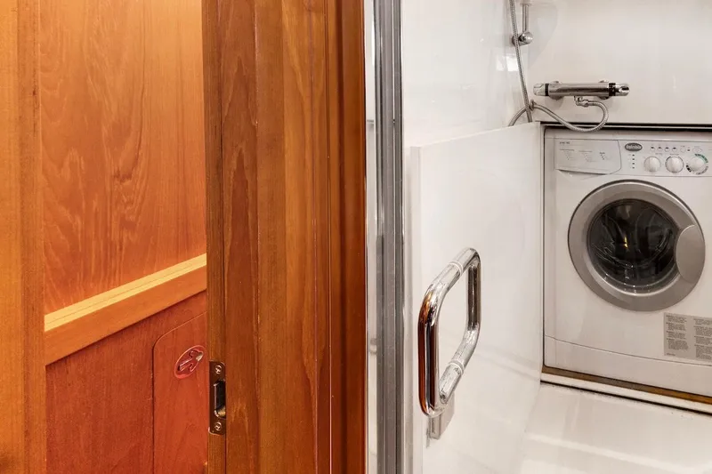 Slide: The Image of Laundry area with washing machine in 2011 Southerly 57 RS yacht. - 57