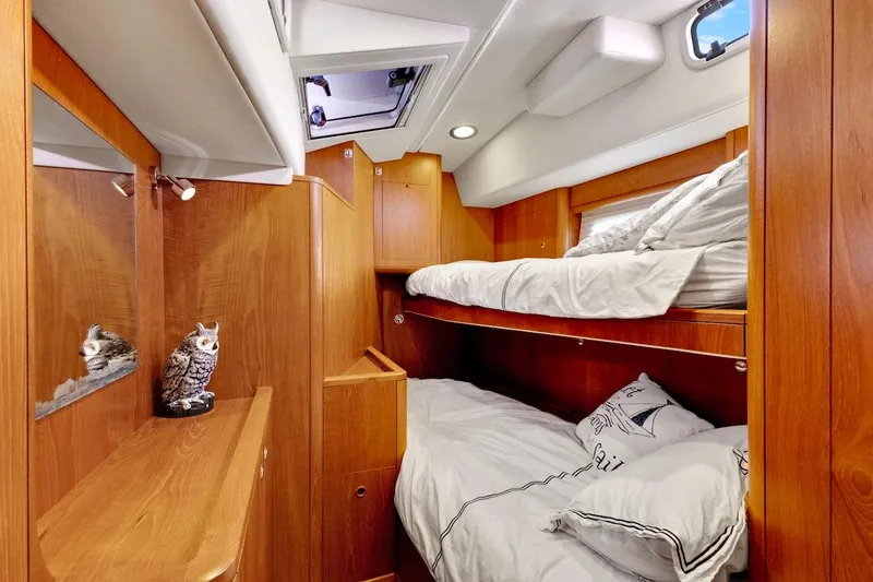 Slide: The Image of Luxurious wooden cabin interior of 2011 Southerly 57 RS yacht with bunk beds. - 58
