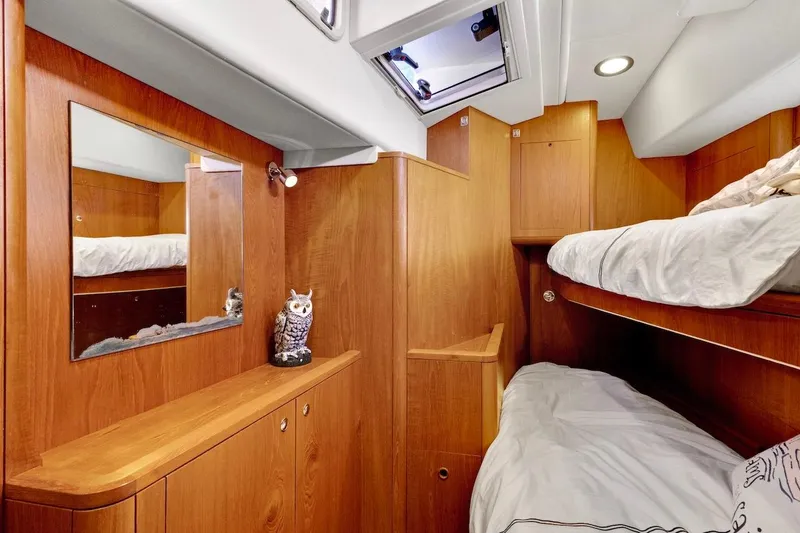 Slide: The Image of Cozy cabin interior of 2011 Southerly 57 RS yacht with wooden finish and bunk beds. - 59