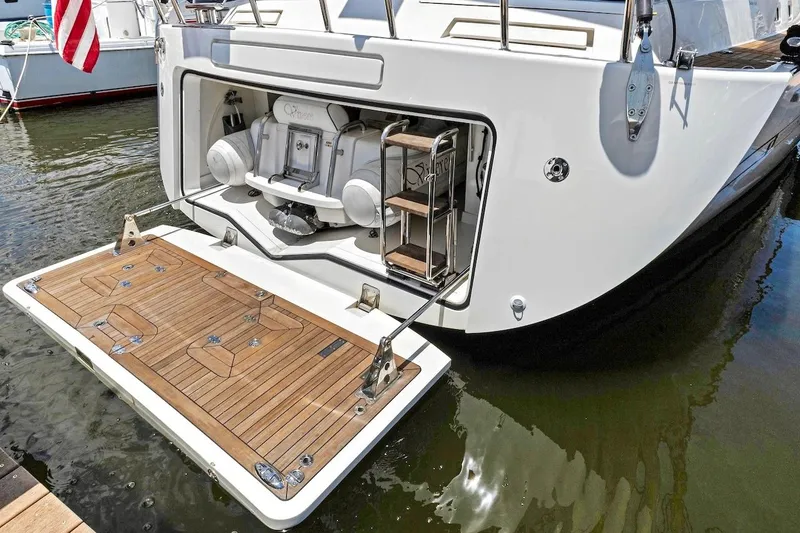 Slide: The Image of 2011 Southerly 57 RS yacht with open swim platform and ladder in marina. - 6
