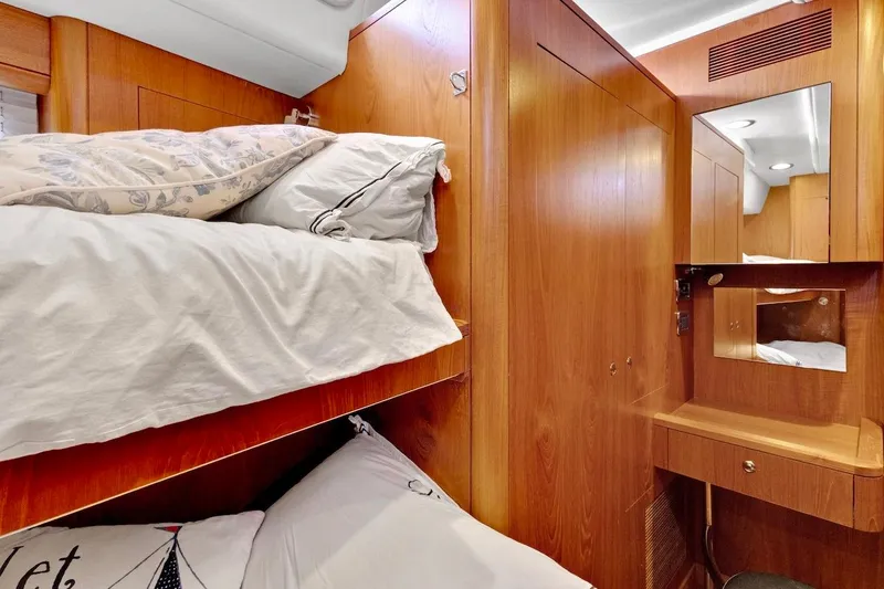 Slide: The Image of Cozy cabin interior of 2011 Southerly 57 RS yacht with wooden finish and bunk beds. - 60