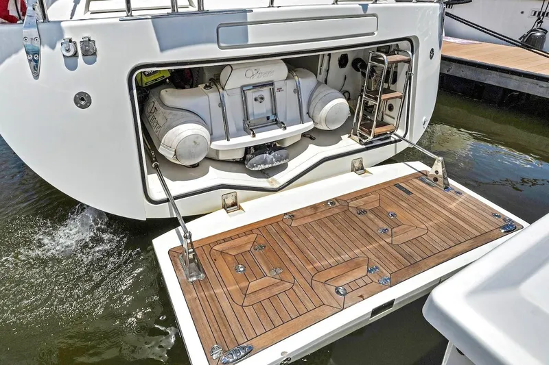 Slide: The Image of Sailing yacht Southerly 57 RS 2011 model with open stern storage and teak swim platform. - 7