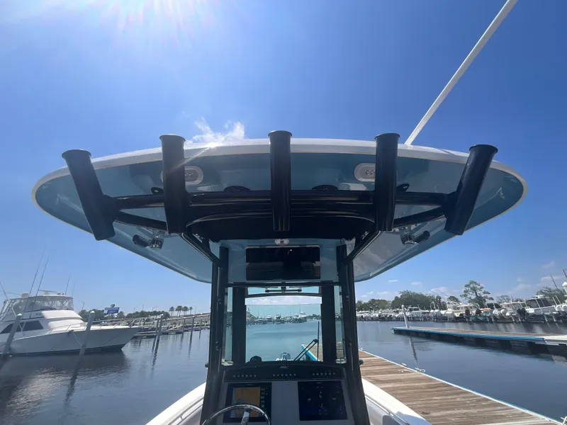 Slide: The Image of The image shows the cockpit of a Boston Whaler 250 Outrage with a modern helm station. - 24