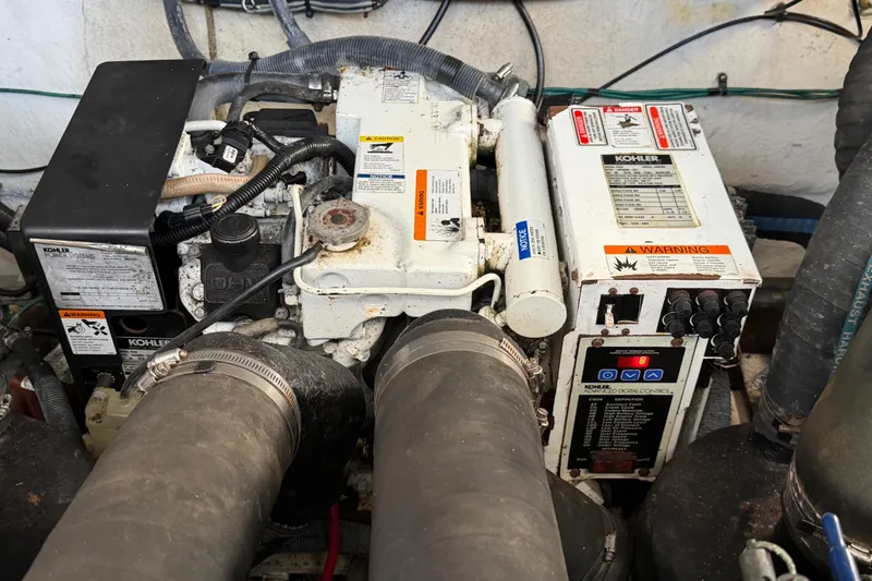 Slide: The Image of Engine compartment of a 2006 Sea Ray Sundancer 320 with Kohler power system. - 26