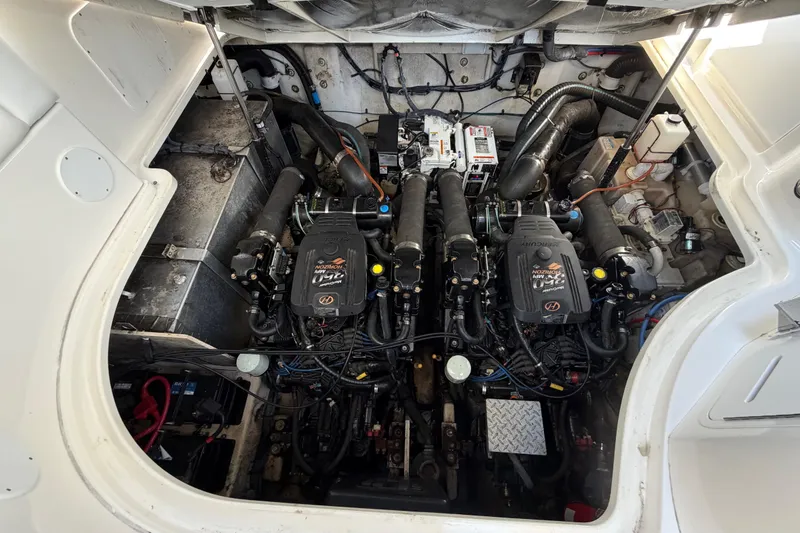 Slide: The Image of Engine compartment of a 2006 Sea Ray Sundancer 320 boat, showcasing dual engines. - 30