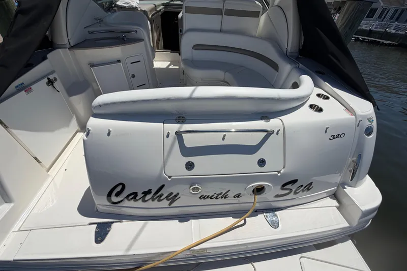 Slide: The Image of 2006 Sea Ray Sundancer 320 boat interior with seating and "Cathy with a Sea" text. - 4