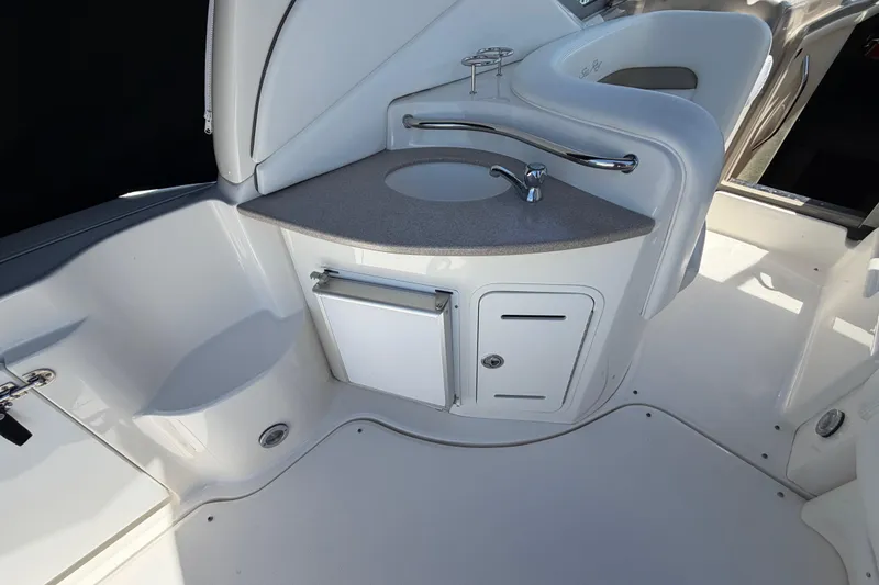 Slide: The Image of 2006 Sea Ray Sundancer 320 boat interior with sink and storage area. - 6