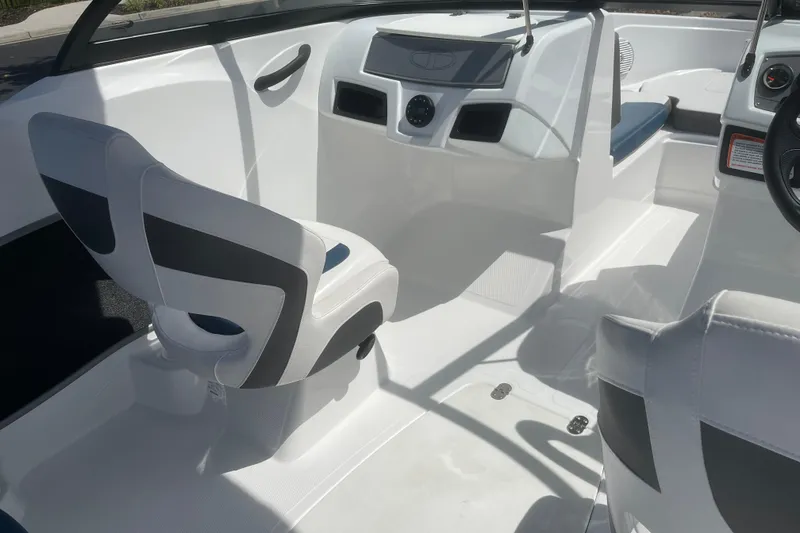 Slide: The Image of 2024 Tahoe 185 S boat interior with modern seating and dashboard design. - 9