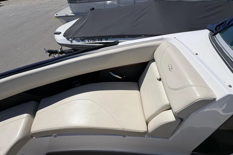 Slide: The Image of 2009 Regal 2500 Bowrider boat with beige seating and sleek design. - 18