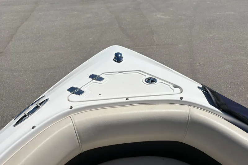 Slide: The Image of Bow of a 2009 Regal 2500 Bowrider boat with seating and deck fittings. - 20