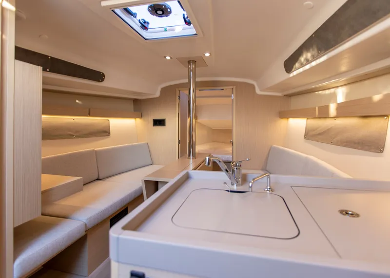 Slide: The Image of Interior of 2026 Beneteau Oceanis 34.1 yacht with bed and stove. - 13
