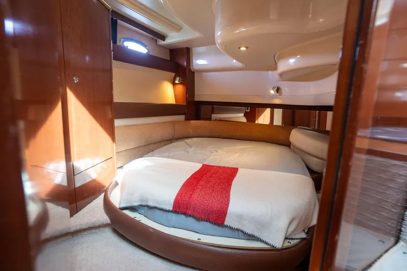 Slide: The Image of Luxurious interior of a 2009 Meridian 391 Sedan yacht with cozy round bed. - 14