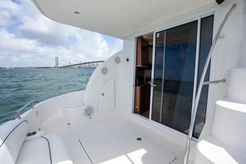 Slide: The Image of 2009 Meridian 391 Sedan yacht deck with ocean view and sliding glass door. - 23