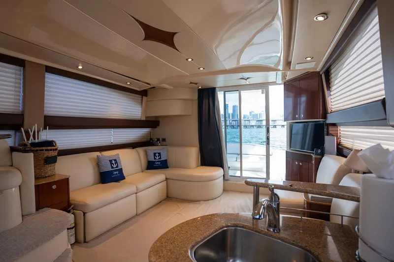 Slide: The Image of Luxurious interior of a 2009 Meridian 391 Sedan yacht with city skyline view. - 28