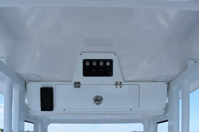 Slide: The Image of 2026 Sea Fox 248 Commander boat console with control panel and storage compartment. - 11